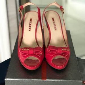 Prada like new in box patent pink wedges with logo